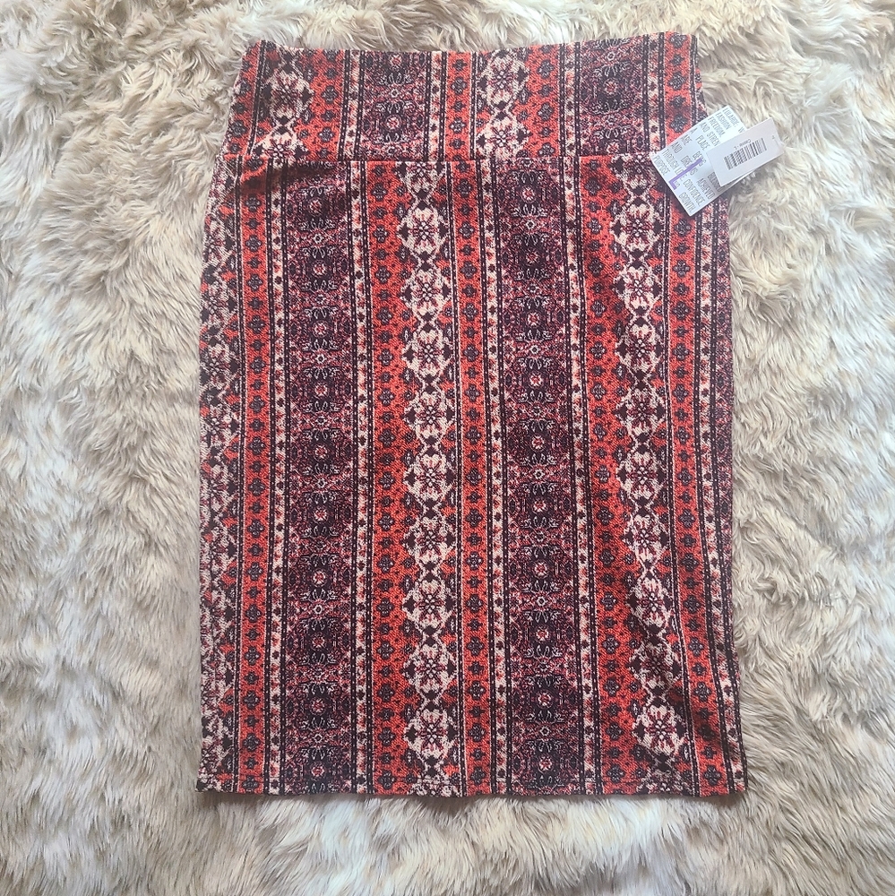 LuLaRoe Cassie skirt. Size Large. Pattern of fallcolors  (orange, cream, black)